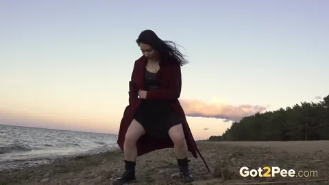 Brunette Pisses and Spreads in a Skirt and Boots on the Beach – photo 13 of 15