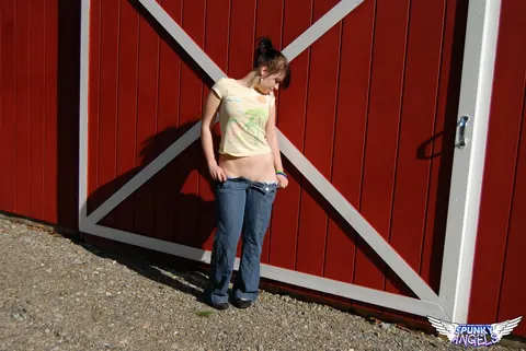 Emily Love: Amateur Brunette Pulls Down Her Jeans and Masturbates in a Barn – photo 4 of 12