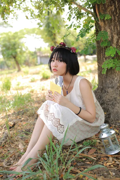 Petite Asian Woman Poses in a White Dress Outdoors – photo 10 of 21