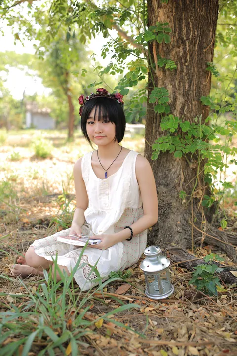 Petite Asian Woman Poses in a White Dress Outdoors – photo 11 of 21
