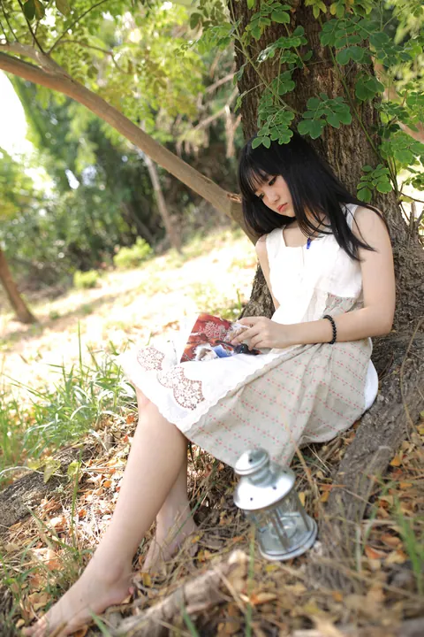 Petite Asian Woman Poses in a White Dress Outdoors – photo 17 of 21