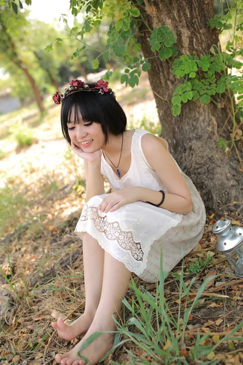 Petite Asian Woman Poses in a White Dress Outdoors – photo 9 of 21