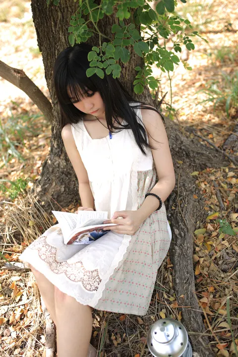 Petite Asian Woman Poses in a White Dress Outdoors – photo 16 of 21