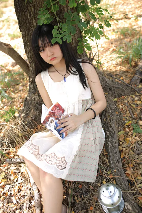 Petite Asian Woman Poses in a White Dress Outdoors – photo 15 of 21