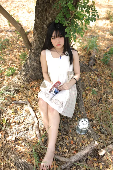 Petite Asian Woman Poses in a White Dress Outdoors – photo 13 of 21