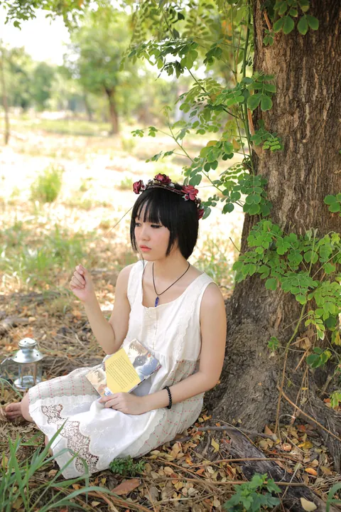 Petite Asian Woman Poses in a White Dress Outdoors – photo 12 of 21