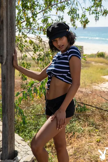 Short-Haired Brunette Flashes Her Body on the Beach