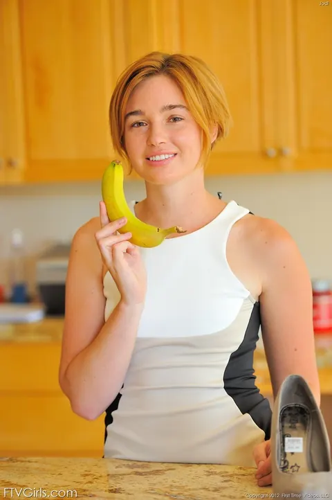 Jodi Taylor: Redhead in a Skirt and Heels Uses Banana as Dildo – photo 9 of 16