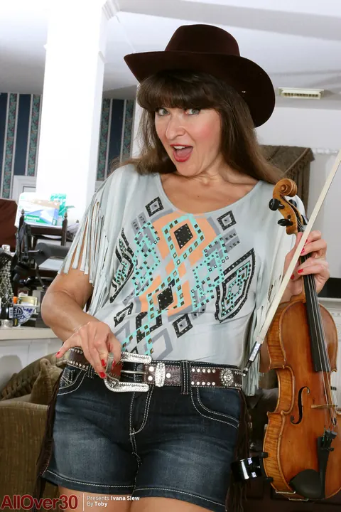 Mature Brunette in Cowgirl Hat Strips and Spreads – photo 4 of 16
