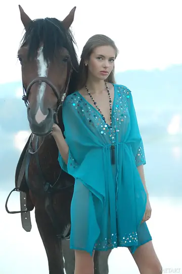 Slim Russian MILF Poses Topless Outdoors with Horses