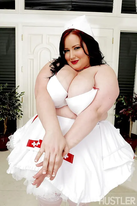 Eliza Allure: Redhead BBW Shows Her Big Tits in a Nurse Uniform and Heels – photo 5 of 16