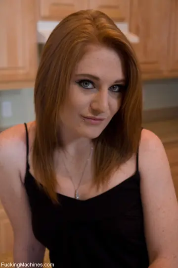 Petite Redhead Tests a Sex Machine on the Kitchen Counter