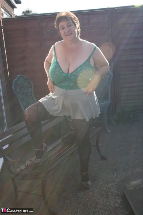 Kinky Carol: Mature Curvy Brunette Poses in Lingerie and Pantyhose Outdoors – photo 13 of 16