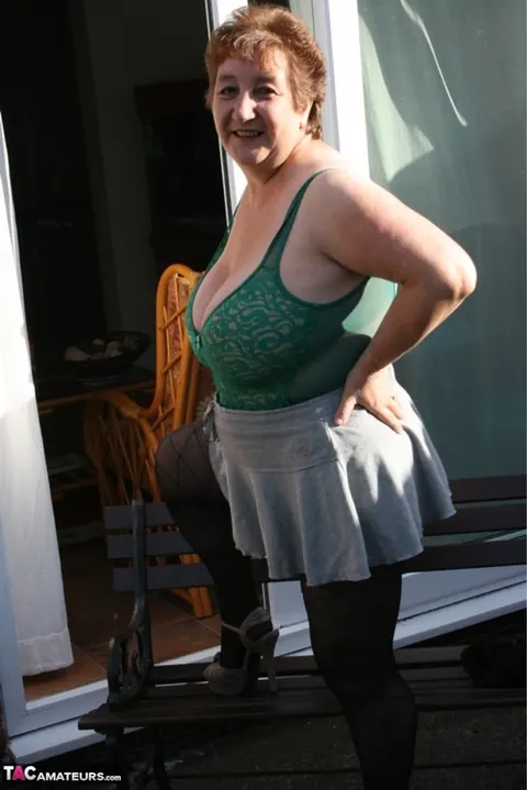 Kinky Carol: Mature Curvy Brunette Poses in Lingerie and Pantyhose Outdoors – photo 12 of 16