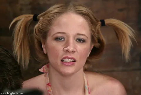 Anna Mills: Blonde MILF in Pigtails Sucks Cock While Hogtied in a Skirt – photo 15 of 21