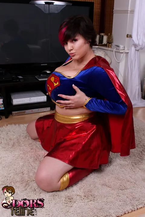 Dors Feline: Thick Brunette MILF Strips Off Her Hero Costume to Show Her Big Natural Tits – photo 2 of 16