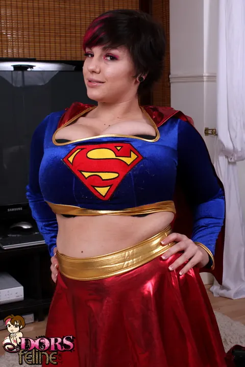 Dors Feline: Thick Brunette MILF Strips Off Her Hero Costume to Show Her Big Natural Tits – photo 1 of 16
