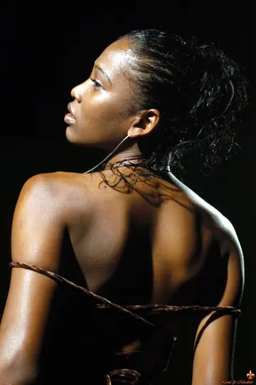 Ebony Woman Undresses and Poses Nude