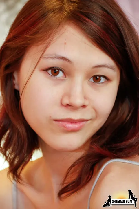Redhead Asian Trans Woman Undresses and Poses Nude – photo 3 of 16