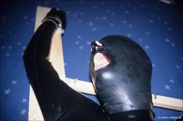 Woman in Latex Uses a Dildo and Spreads in Bondage