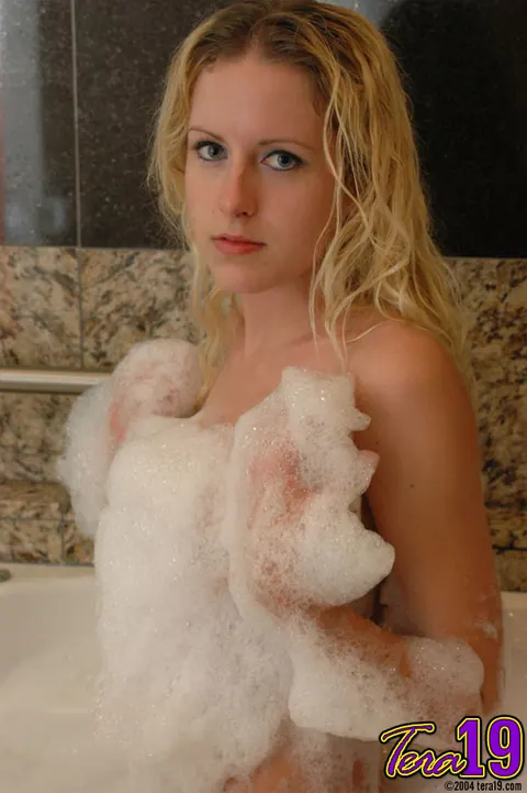 Blonde Blows Soap Bubbles in the Bathroom – photo 6 of 12