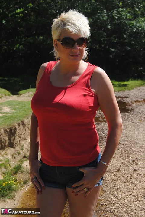 Mature Blonde in Glasses Strips Out of Her Bikini Bottoms Outdoors – photo 5 of 19