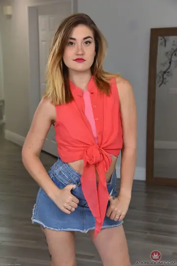 Redhead with Small Natural Tits and Tattoo Spreads Her Pussy
