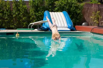 Mature Blonde Sheds Her Bikini After Pool Dip