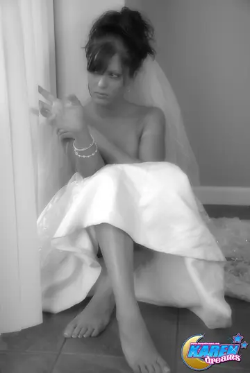 Brunette Amateur Poses in Her Wedding Dress and Lifts the Skirt