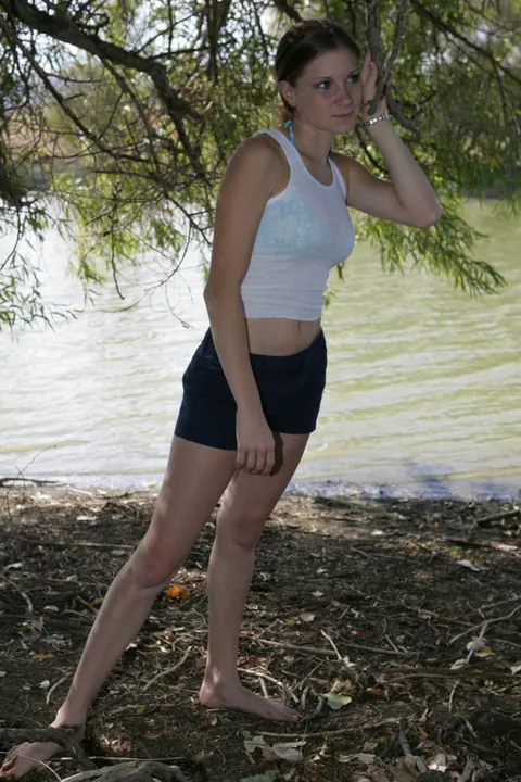 Petite Russian Woman Poses in a Bikini and Shorts on the Beach – photo 14 of 20