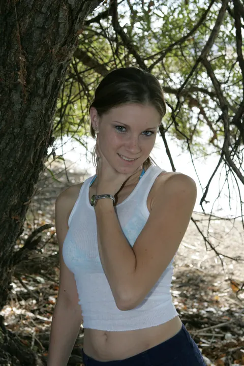 Petite Russian Woman Poses in a Bikini and Shorts on the Beach – photo 16 of 20