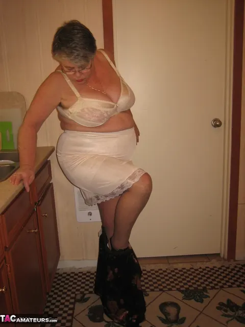 Curvy Short-Haired MILF Strips Off Her Lingerie in the Kitchen – photo 8 of 20