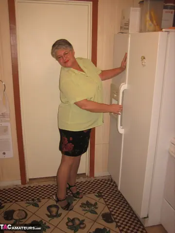 Curvy Short-Haired MILF Strips Off Her Lingerie in the Kitchen