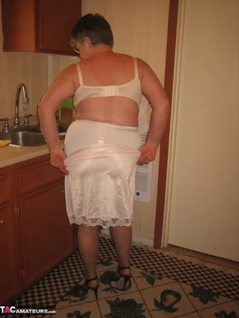 Curvy Short-Haired MILF Strips Off Her Lingerie in the Kitchen – photo 10 of 20