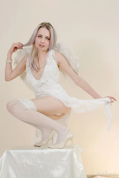 Pale Blonde Spreads in Stockings and Skirt – photo 3 of 16