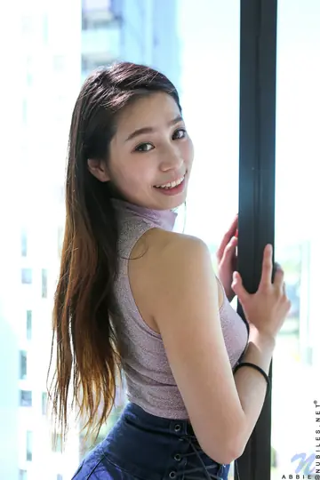 Asian Woman Pulls Shorts Aside and Fingers Her Pussy