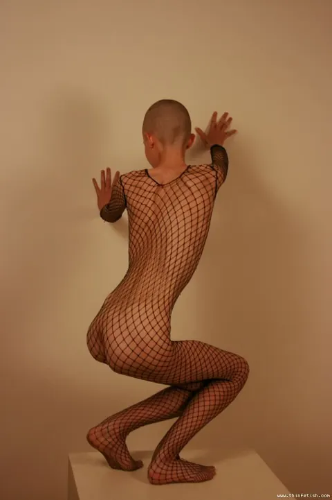 Skinny Shaved-Head Model Shows Her Pussy in Fishnet Pantyhose – photo 13 of 16