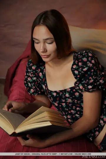 Woman with Book Strips Nude and Spreads Her Shaved Pussy