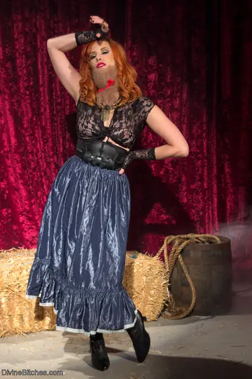 Maitresse Madeline Marlowe – Busty Redhead in Lingerie and Stockings Poses as Femdom