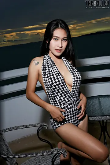 Asian Blonde with Big Tits Bares All on a Seaside Balcony