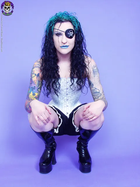 Jen Vixen: Tattooed Brunette in Cosplay Boots and Skirt Shows Her Shaved Pussy – photo 9 of 15