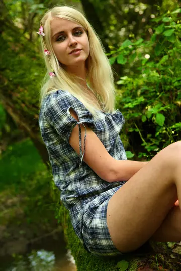 Blonde Fingers Her Shaved Pussy on a Tree Limb Outdoors