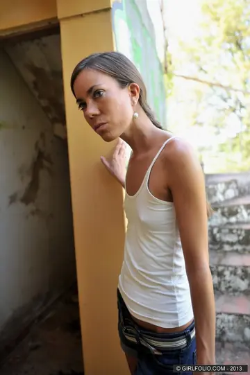 Skinny Brunette Strips Out of Her Denim Shorts and Spreads