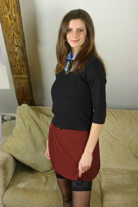 Thick Brunette with Big Tits Poses in Stockings and a Skirt – photo 1 of 21