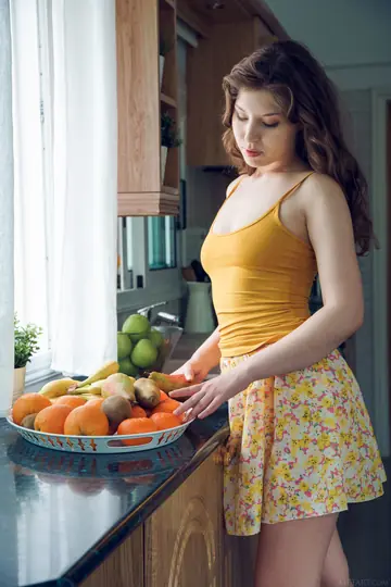 Petite Ukrainian in a Dress and Socks Undresses in the Kitchen