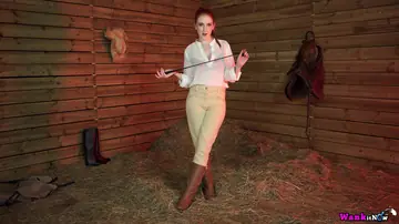 Alexa Red – Busty Redhead in Lingerie and Boots Strips in a Forest Horse Stall