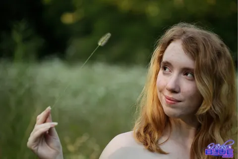 Nicki Blue: Redhead with Big Enhanced Tits Poses Nude in an Overgrown Field – photo 8 of 15