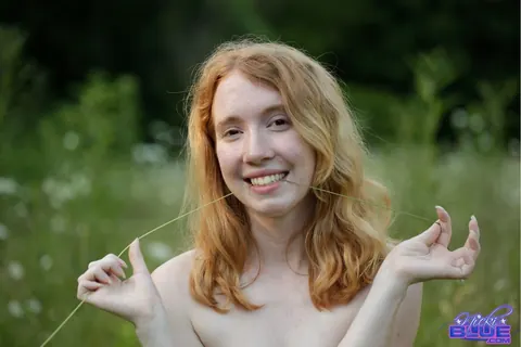 Nicki Blue: Redhead with Big Enhanced Tits Poses Nude in an Overgrown Field – photo 11 of 15