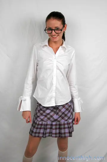Slim Brunette MILF Lifts Her Uniform to Show White Panties
