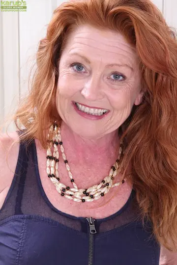 Busty Redhead MILF Spreads Her Legs in Stockings